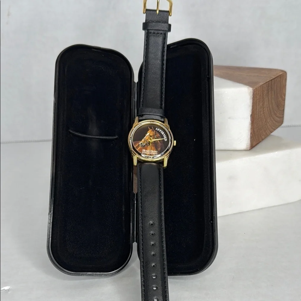 Vintage Affirmed Black and Gold Watch with Horse Design lot W2